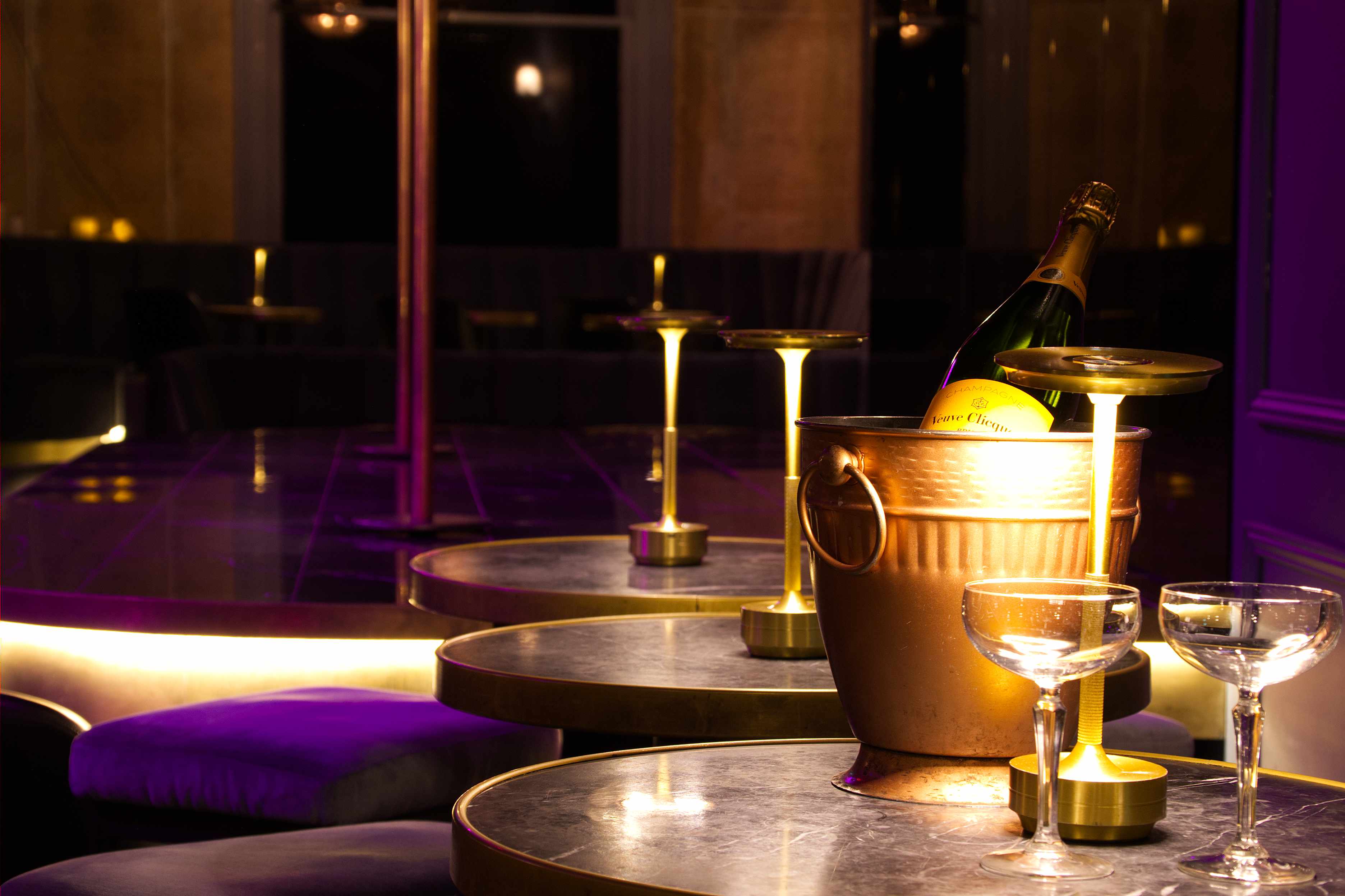 Inside Bon&middot;Bon &mdash; the Art Deco room with pole stage, velvet seating and champagne service